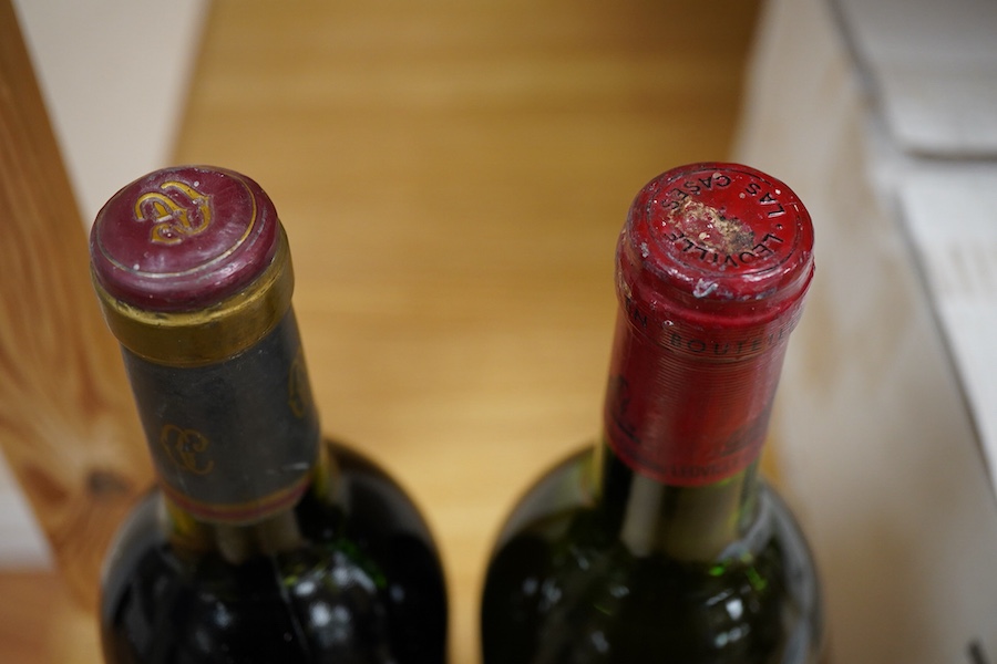 A bottle of Grand Vin de Léoville du Marquis de Las Cases Saint-Julien, 1976 and a bottle of Cordier Chateau Gruaud LaRose Saint-Julien 1982